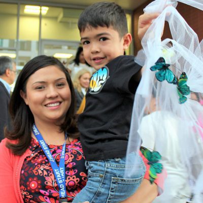 2015 City Headstart Partner MomSon with Ribbon after Ribbon Cutting 92915 450pm Mom with Son with Ribbon after Ribbon Cutting